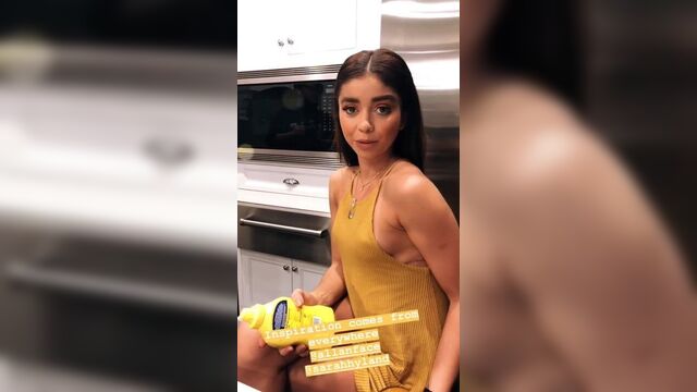 Sarah Hyland with pokie nipples in short yellow dress