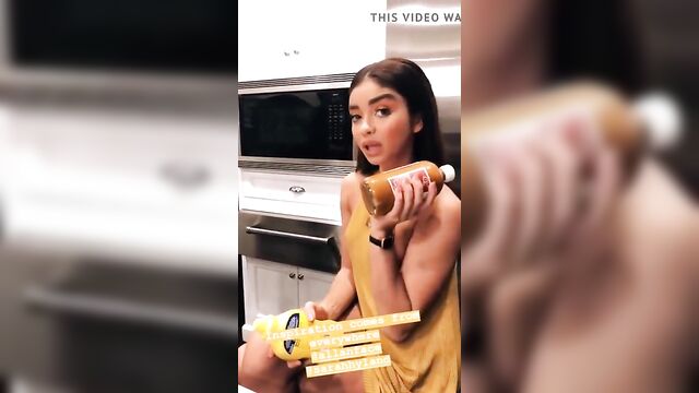 Sarah Hyland with pokie nipples in short yellow dress