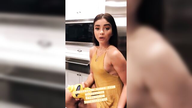 Sarah Hyland with pokie nipples in short yellow dress