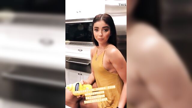 Sarah Hyland with pokie nipples in short yellow dress