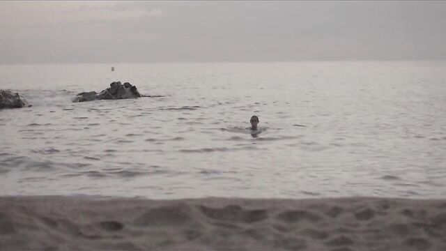 A beautiful woman, a passionate man and a nude beach