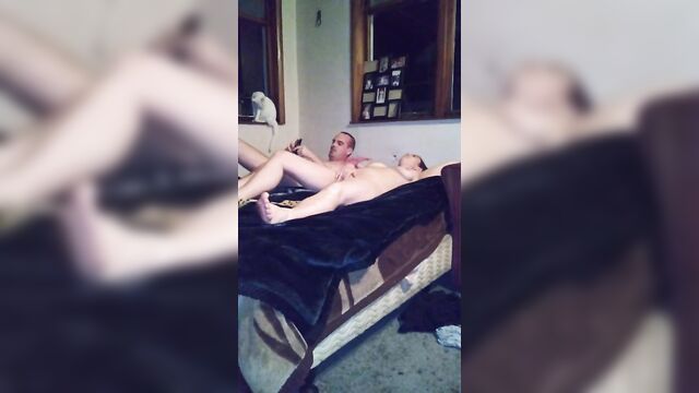 Couple having sex from behind lying down