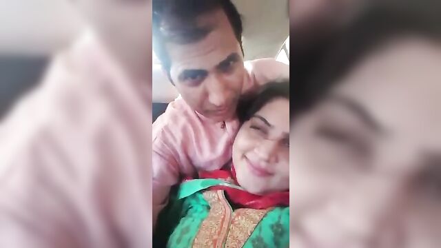Pakistani couple romance and kissing in car