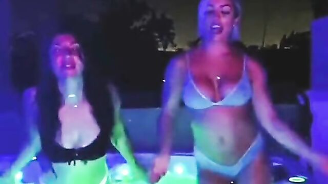 Mandy Rose and a hot brunette dancing in hot tub