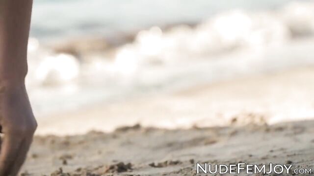 Exotic cutie Natalia playing on a sandy beach