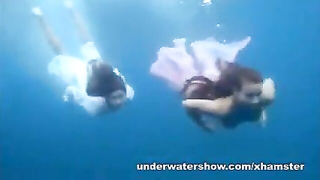 3 girls stripping in the sea