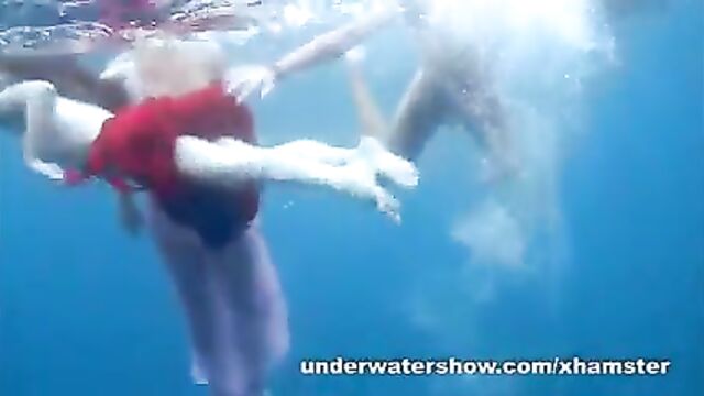 3 girls stripping in the sea