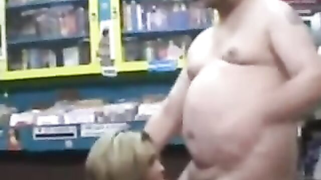 Woman randomly sucks a dirty video store clerk