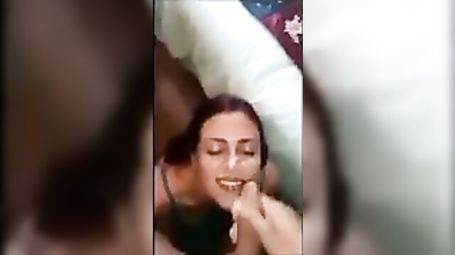 Cumming al over her pretty face and she loves it