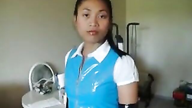 Asian in blue PVC skirt and top