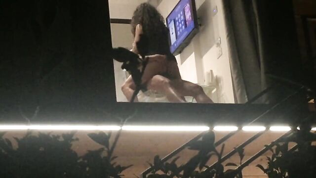Voyeur caught horny couple fucking through hotel window