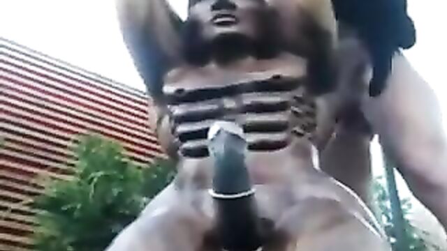 Camgirl fucks a wooden statue in her garden