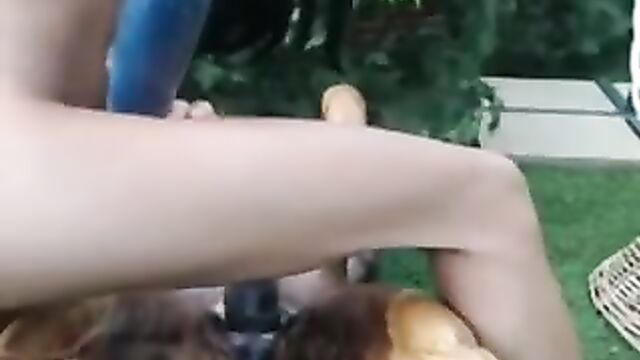 Camgirl fucks a wooden statue in her garden