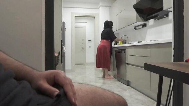 Risky jerking off while watching big ass hijab maid in the kitchen.
