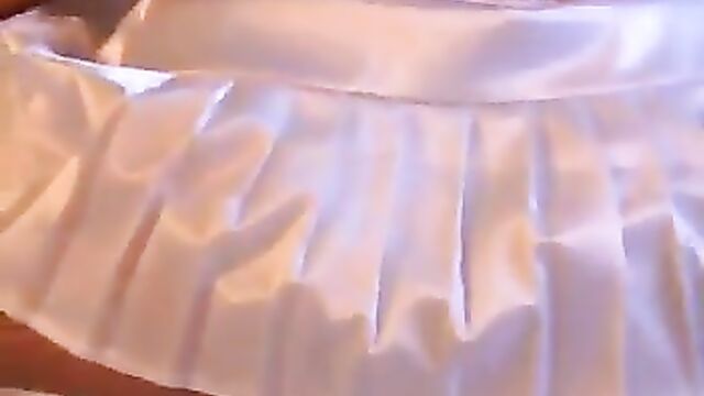 Jesse teases in white satin skirt and panties