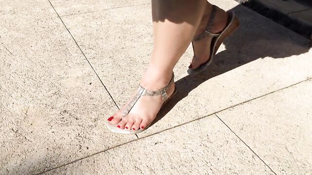 Super sexy long red toenails and glamorous thong sandals