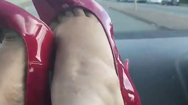 Red Stiletto Heels in Car