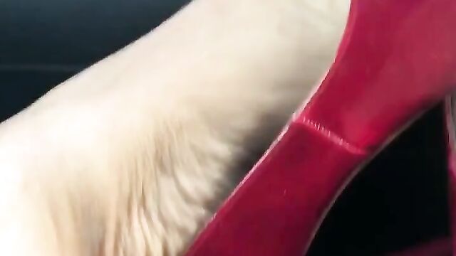 Red Stiletto Heels in Car