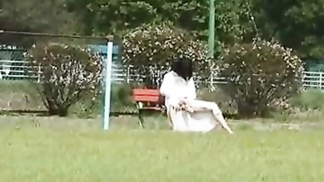 Asian MILF in public playground