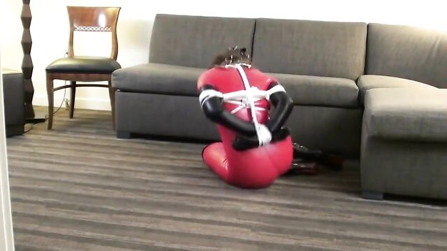 Red Latex Catsuit Girl Muzzled and Tied Up