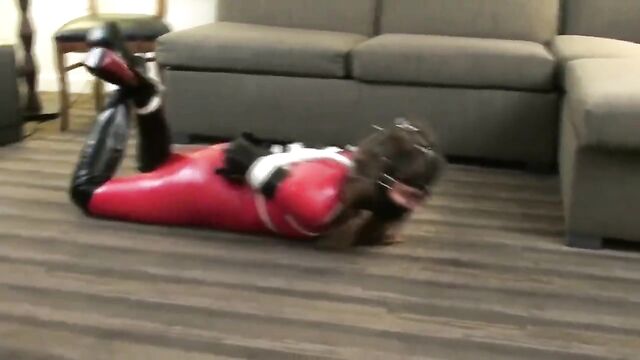 Red Latex Catsuit Girl Muzzled and Tied Up