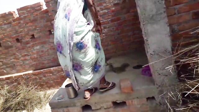 Beautiful Indian bhabhi pissing on her house roof and fingering her cremei tight pussy
