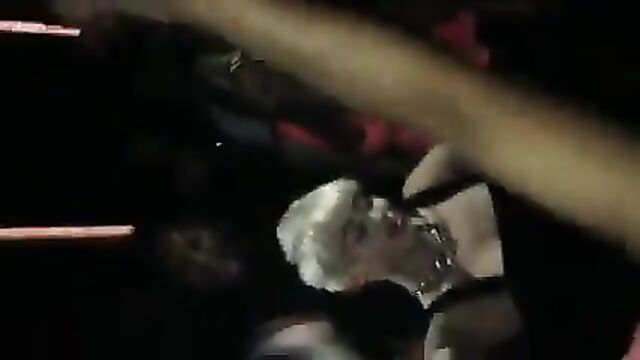 Miley Cyrus dancing in a club