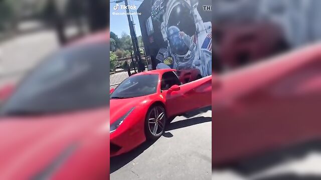 Saxon Sharbino posing in a red car