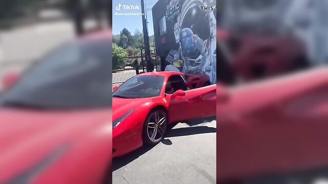 Saxon Sharbino posing in a red car