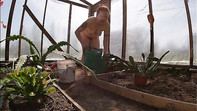 Naked Greenhouse Worker Planting Cacti