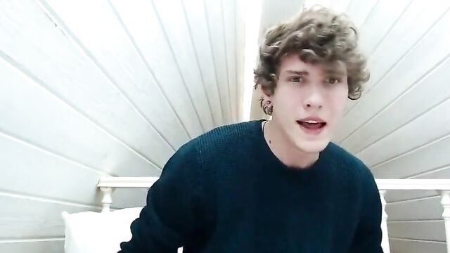 handsome boy with curly hair cums