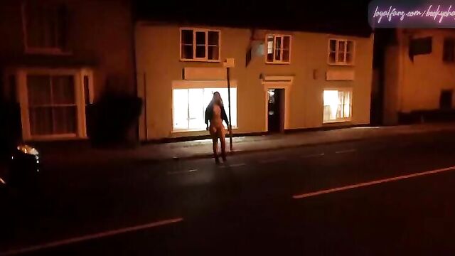 Young blonde wife walking nude down a high street in Suffolk