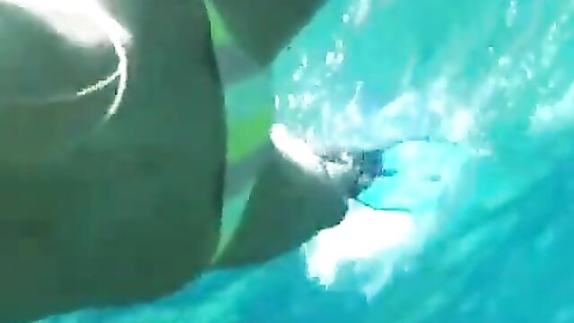 Heidi Klum swimming underwater in a bikini