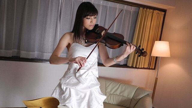 Horny Yuria Tominaga plays a violin and rubs her pussy