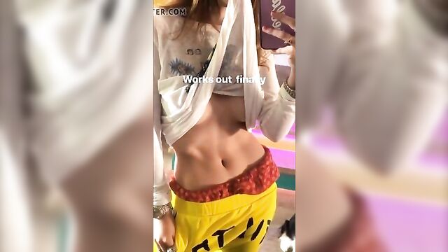 Bella Thorne showing off her stomach and underboob