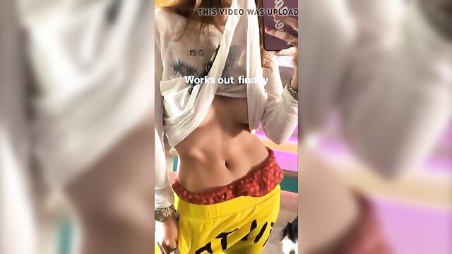 Bella Thorne showing off her stomach and underboob