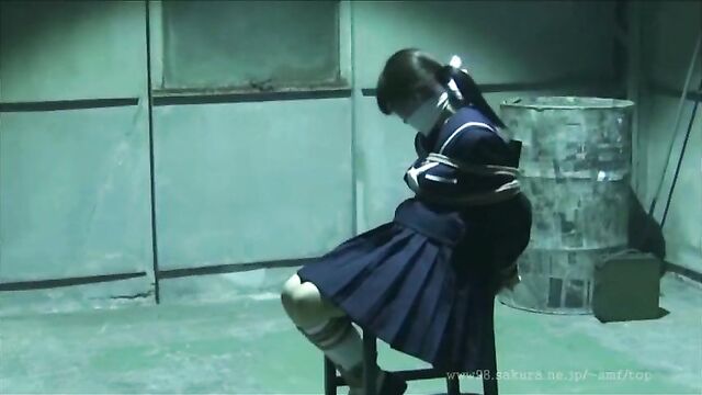 Japanese Schoolgirl tied and gagged in warehouse