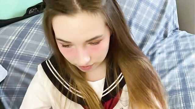 Cutie in Japanese school uniform touches your cock and gets embarrassed