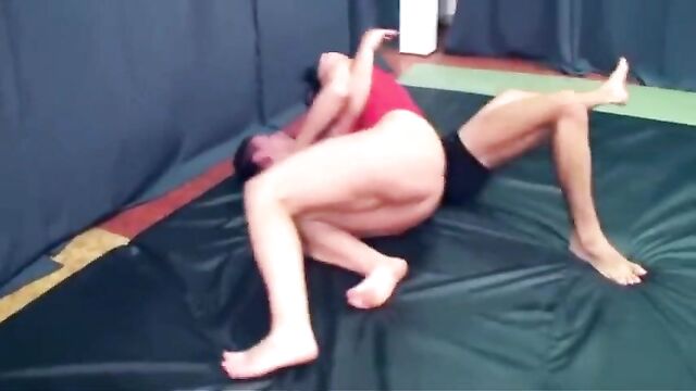 Mixed wrestling -strong female overpowered (grapevine pin)